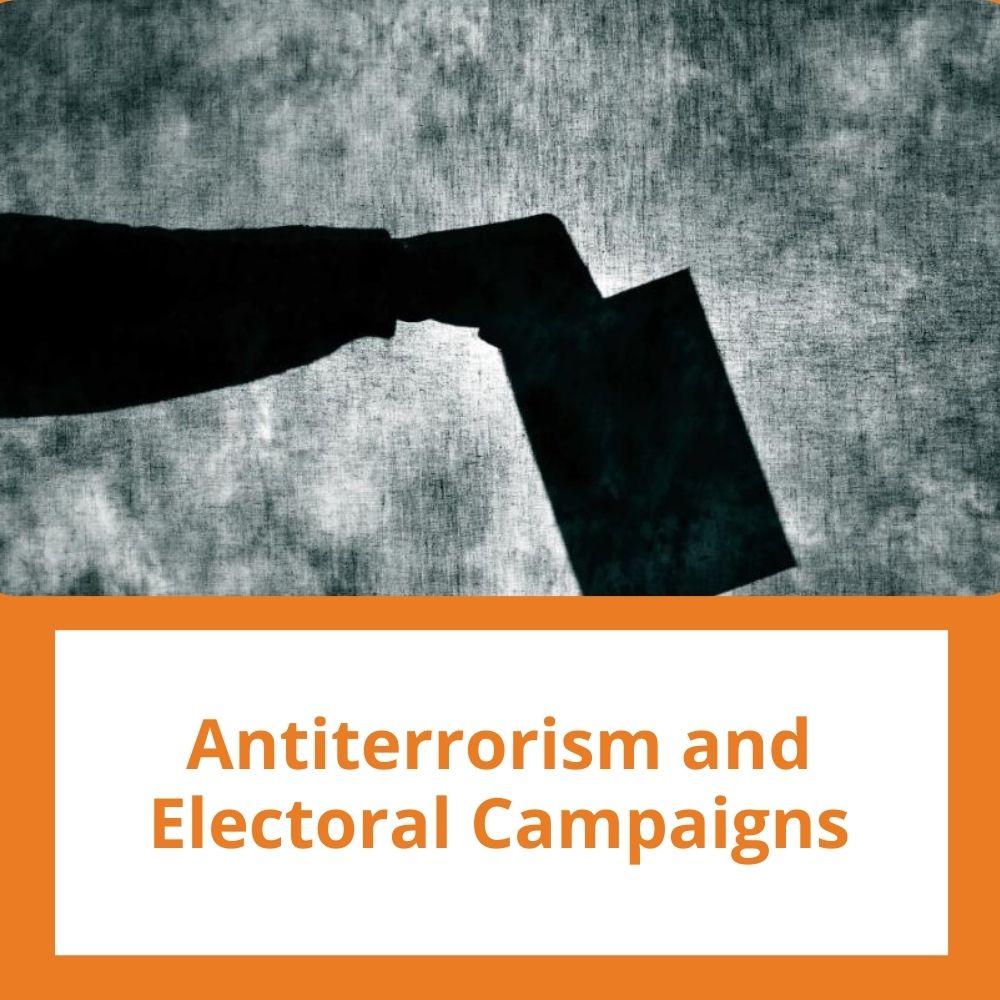 Image: a hand holding a ballot. Link to related stories. Story headline: Antiterrorism and Electoral Campaigns